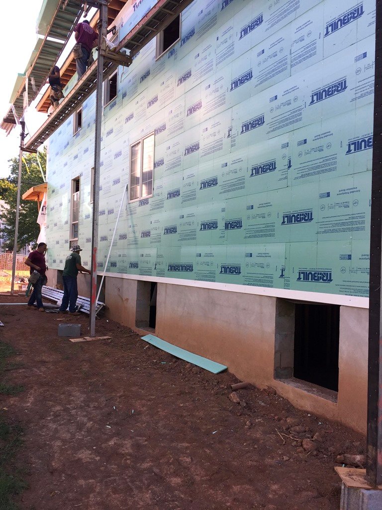 House wrap and window openings during exterior installation