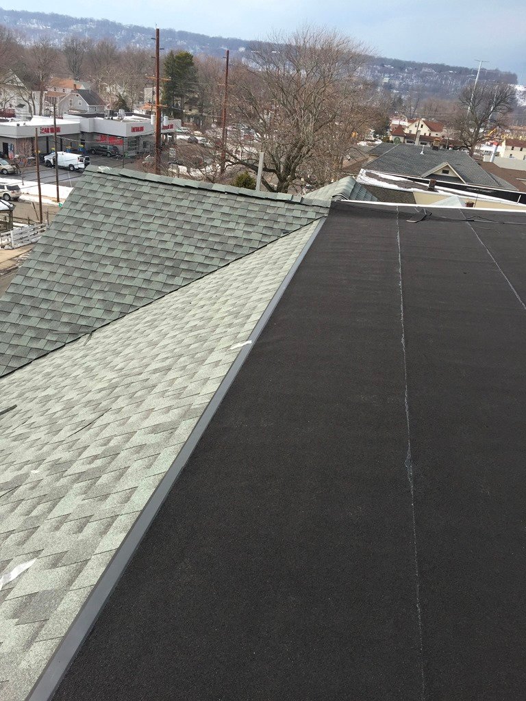 Shingle and low-slope roof surfaces from the company gallery