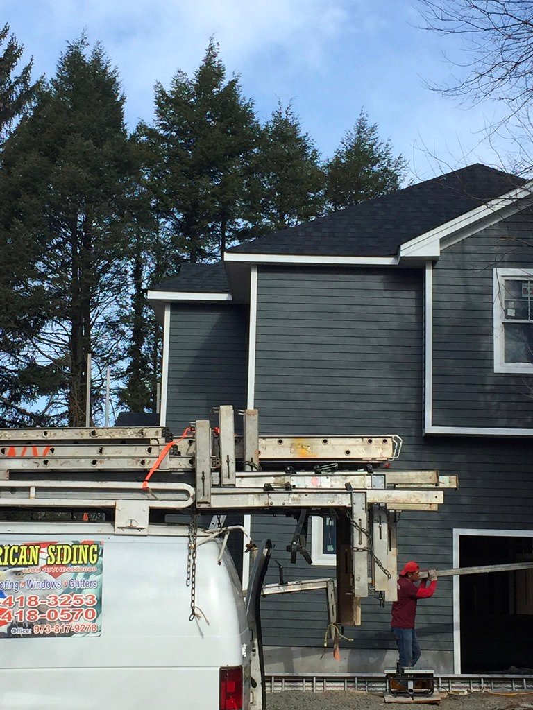 Gray horizontal siding installation from the company gallery